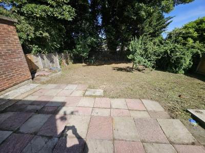 Patio slabs laid across a Kent back garden
