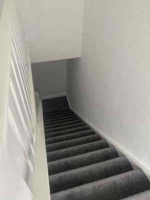 Ceiling and walls repainted after plastering repairs in Medway